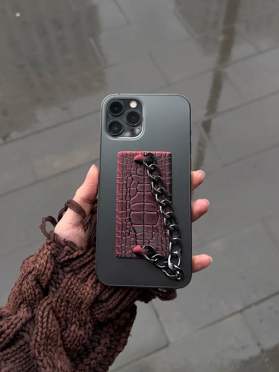 THE GRIP leather pad and chain on phone